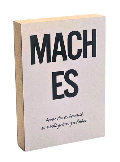 Holzbild 8,5 x 12 cm mit schwarzer Schrift auf rosa-beigem Hintergrund "Mach es, bevor du es bereust, es nicht getan zu haben."